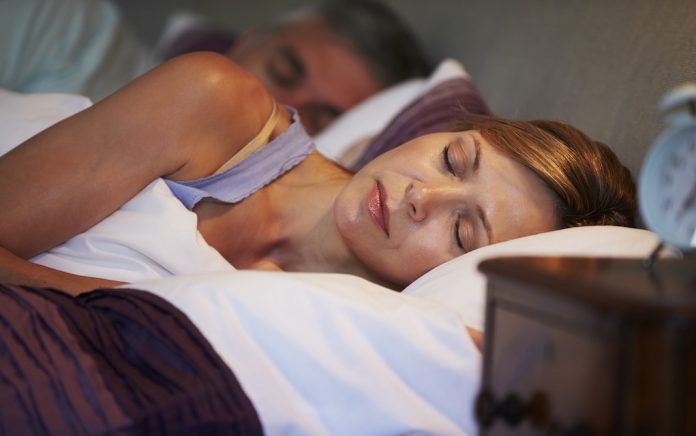 Couple Asleep In Bed